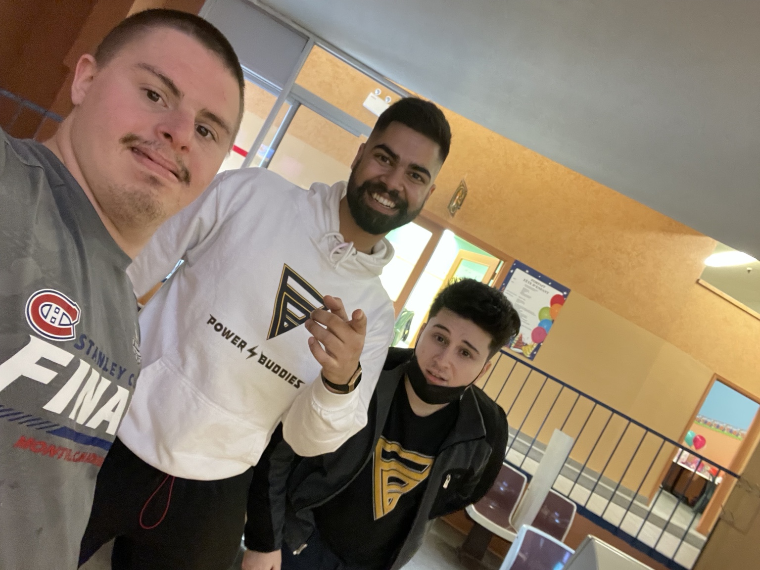 Three buddies taking a selfie indoors