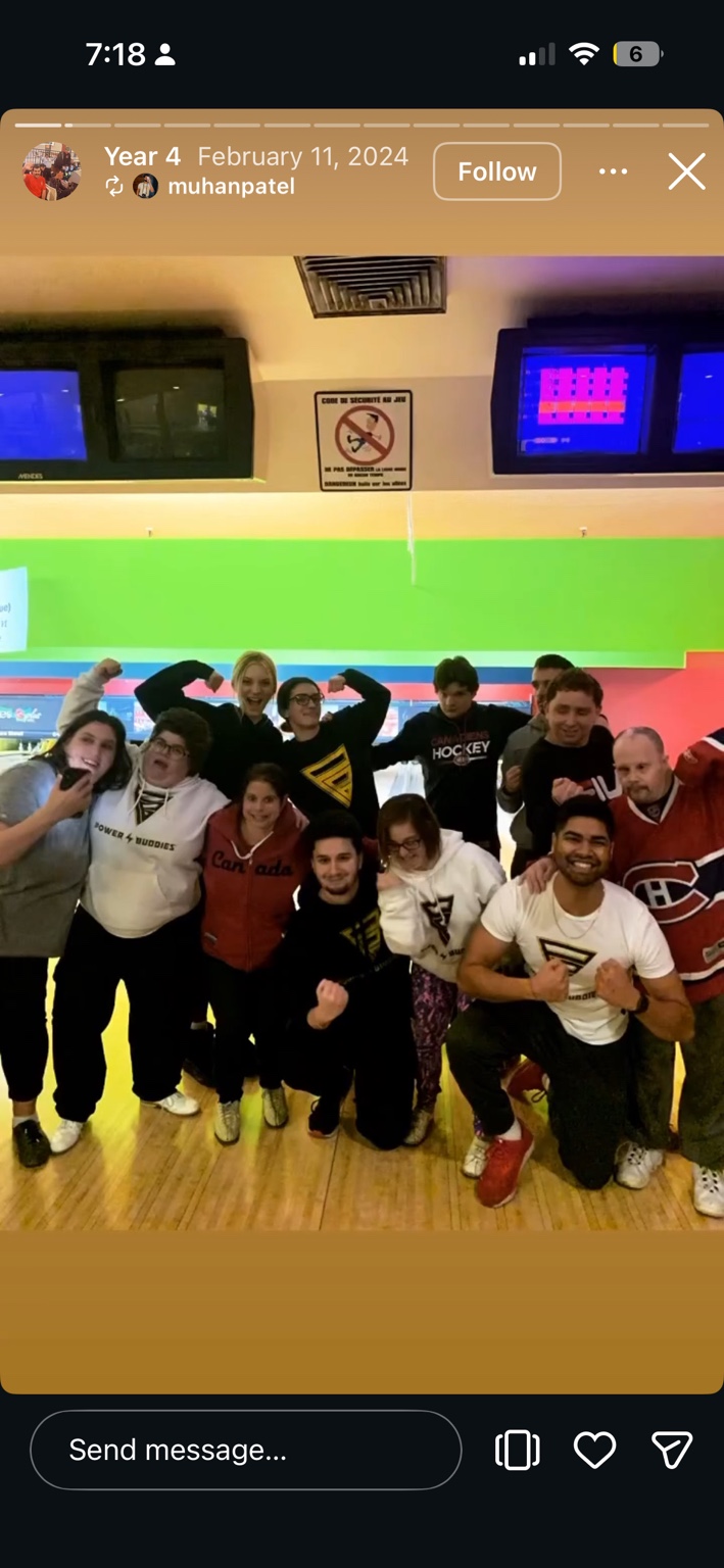 Buddies posing and flexing together at a bowling outing