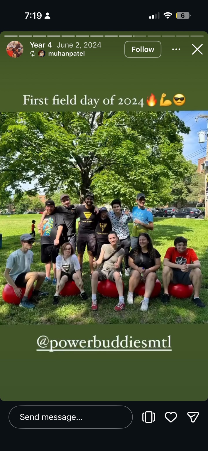 Buddies posing together with red exercise balls during a field day